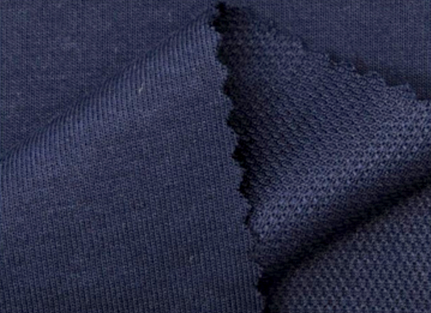 Close-up of navy Dry-Tech fabric in two knit textures