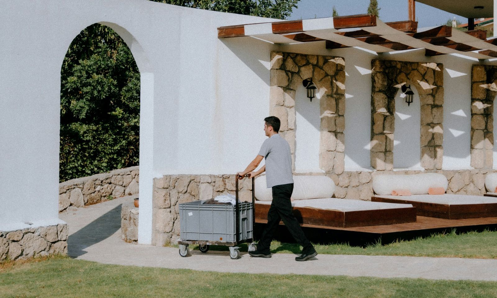 Resort staff pushing an equipment cart